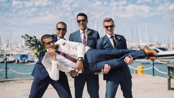 A group of men posing for a photo

Description automatically generated with low confidence